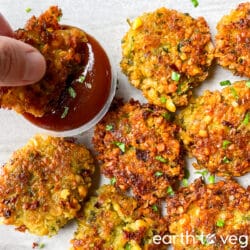 Freshly fried paruppu vadai is dipped in spicy ketchup.