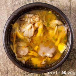 Chinese oyster mushroom soup with oyster mushrooms, scallions, and golden sesame oil broth.
